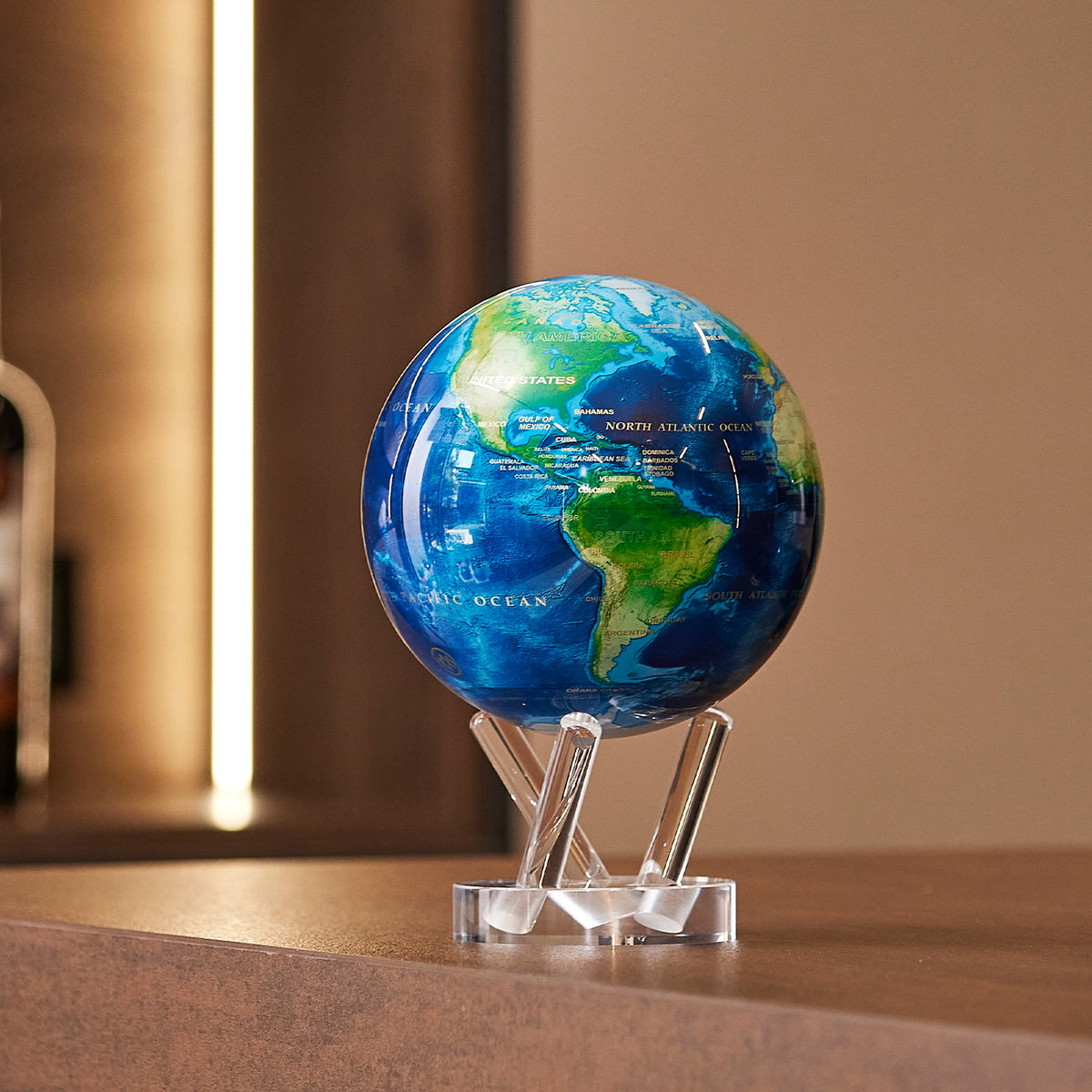 Earth Turquoise Gem globe displayed in a modern living room