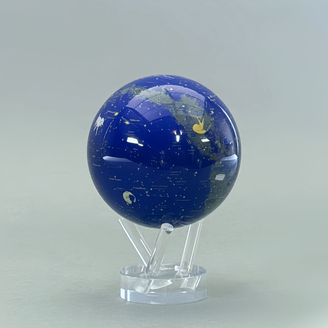 Close-up of The Little Prince Constellation MOVA Globe on acrylic base