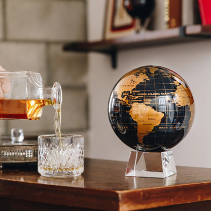 BLACK AND GOLD GLOBE | Hidden magnets provide movement - MOVA US